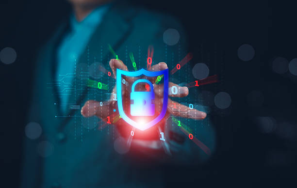 istock A person in a suit holds a glowing padlock icon, symbolizing cybersecurity and digital protection amidst a digital background. 2207010720