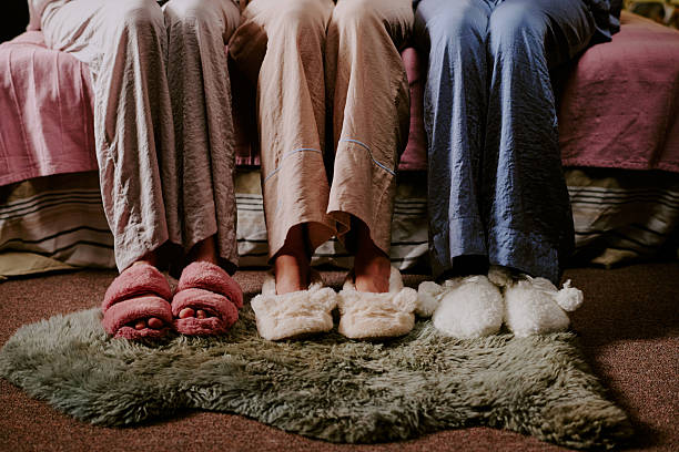 istock Female Feet in Slippers 2207014133