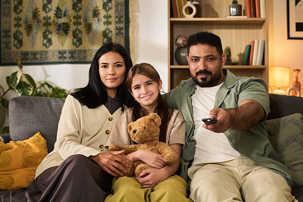 istock Relaxing Family Time While Watching TV at Home Together 2207014226