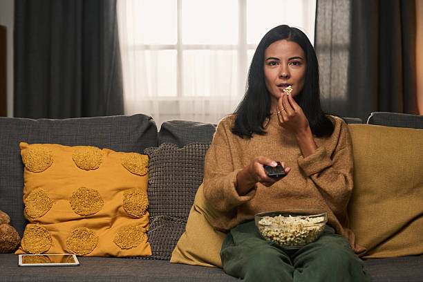 istock Watching Movie at Home with Popcorn and Remote Control 2207014278