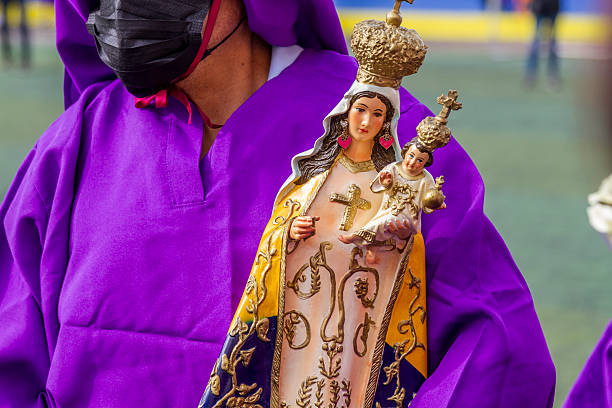 statue of the nun saint rita holding the cross of jesus christ in her hand with a suffering look