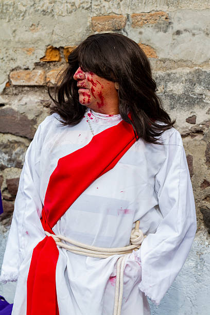 Quito, Pichincha, Ecuador - April 15, 2022: People portraying Jesus wait for the procession to begin during a Holy week.