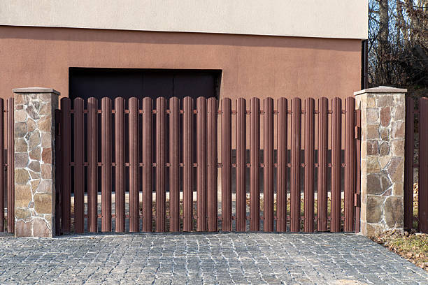 istock Swing gate with metal picket fence 2207016173