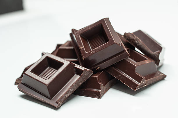 istock Chocolate bars isolated on white , black cocoa 2207016307