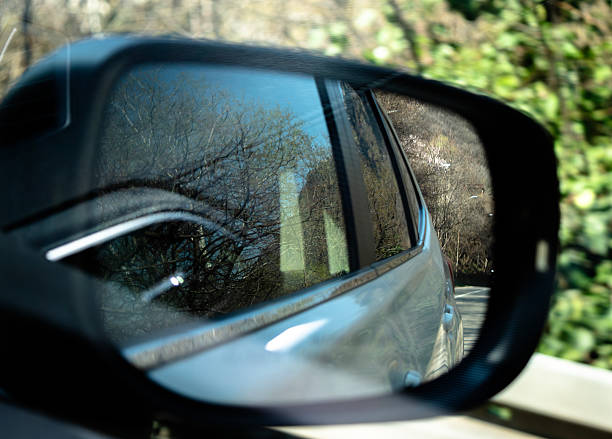 istock Reflections of nature viewed through a car side mirror 2207016921