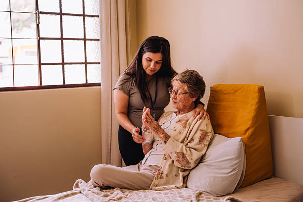 istock Volunteer talking to elderly people 2207018092
