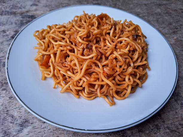 Delicious Mi Goreng Or Fried Noodle On A Plate. Food Menu.