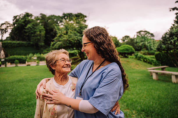 istock Nurse with elderly woman in nursing home 2207018682