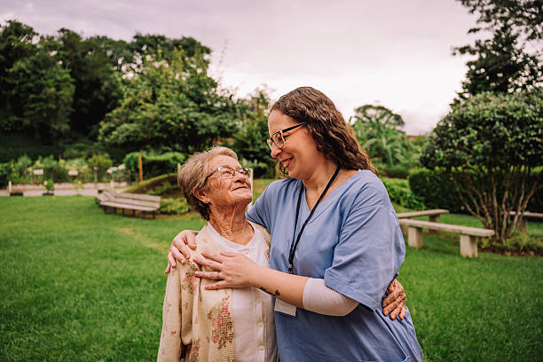 istock Nurse with elderly woman in nursing home 2207018685