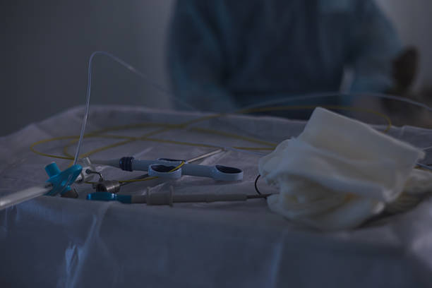 istock The finished endoscopic tool is laid out on the table at the surgeons. Sterile surgical devices and gauze lie on the table, ready for use, with a blurry surgeon in the background. 2207019012