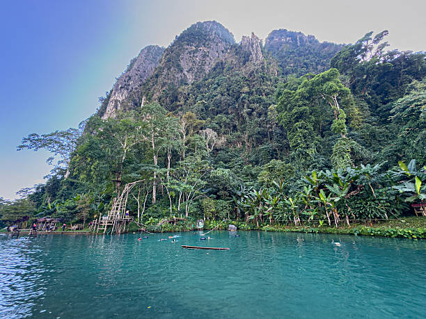 Natural pool surrounded by lush jungle near Vang Vieng, Laos. High quality photo
