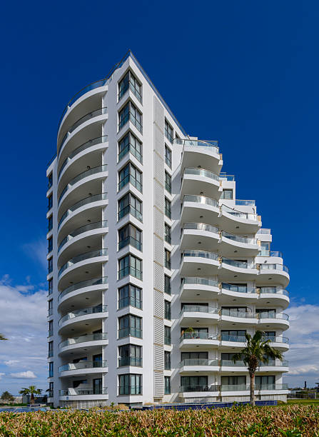 istock Modern architectural marvel rises against a brilliant blue sky in a coastal paradise 2207021427