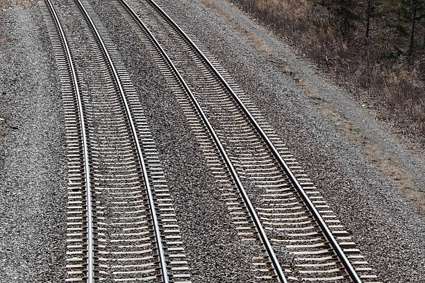 North and southbound train tracks nestled along the Hudson River Valley in New York State.