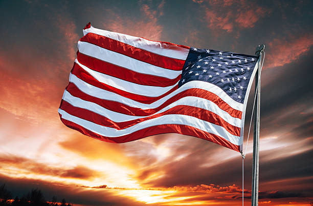 istock american flag against the sky at dusk 2207023255
