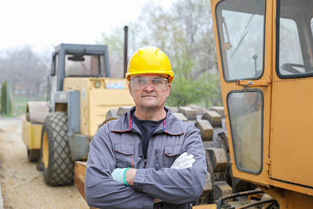 Portrait of an Earth Digger Driver with blueprint in hand