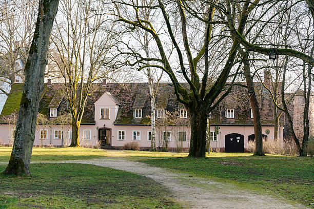 istock Charming Countryside House Amidst Bare Winter Trees 2207025163