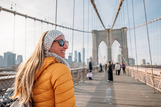 istock Woman Enjoying a Walk on Brooklyn Bridge 2207025613