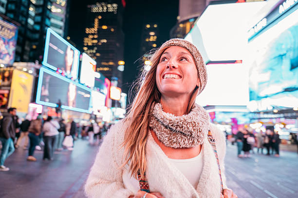 istock Woman Enjoying Illuminated Cityscape at Night 2207025792