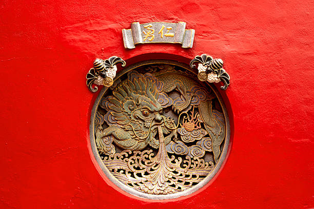 istock Chinese dragon inside the circle on the red wall 2207027801