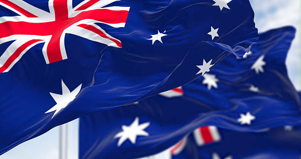 istock Australian flags waving dynamically, photorealistic 3D render of national pride 2207029089