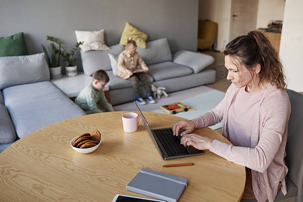 istock Single Mother Working with Laptop at Home 2207029891