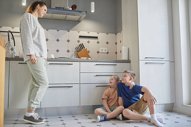 istock Single Mother with Two Kids at Home 2207029995