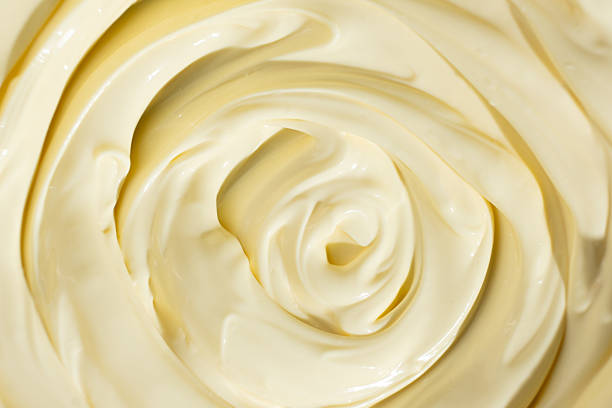 istock Abstract Food Background. Swirled Mayonnaise Spread 2207030985