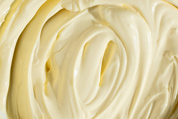 istock Abstract Food Background. Swirled Mayonnaise Spread 2207030988