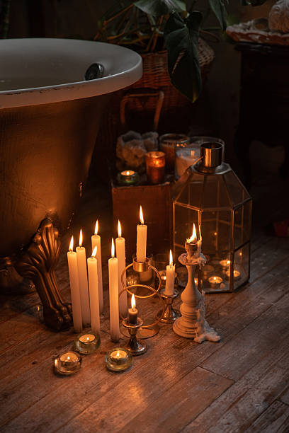 istock Atmospheric bathroom with candles and a vintage bathtub 2207031576