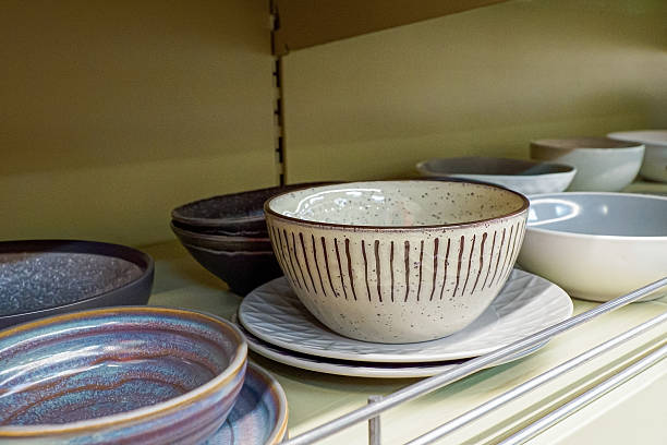 istock Tableware. Kitchen utensils. A shelf with plates at a home improvement store. Consumerism. 2207032719
