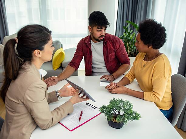 istock Black couple with a financial advisor 2207034824