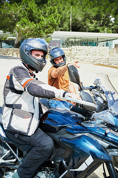 istock Bikers are getting ready for a motorcycle trip and are discussing the route 2207035131