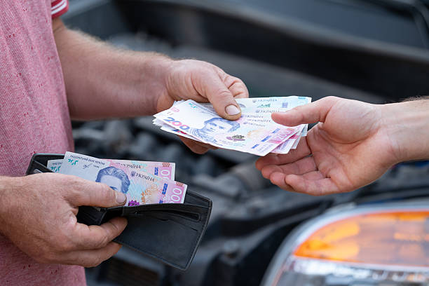 istock Payment for car repair in a garage 2207035654