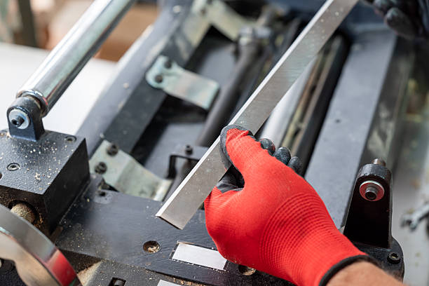 istock A woodworker in gloves with new sharp knife 2207035658