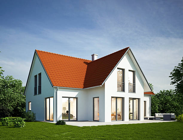 istock Modern white house with red roof in the evening 2207035682