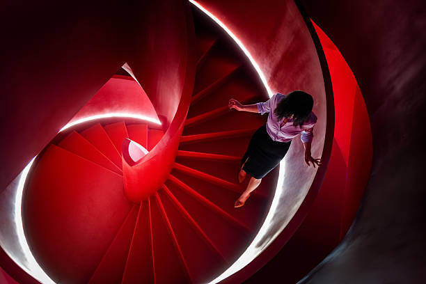 Women walk down the spiral stairs