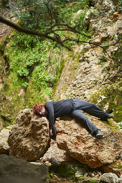 istock Injured hiker lying on rocks after falling in the mountains 2207038293