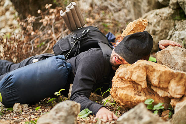 istock Young hiker resting after mountain accident 2207038682