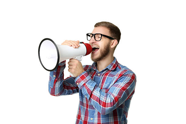 istock Young man screaming in megaphone on white background 2207039452