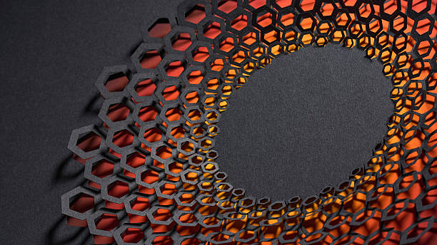 Still life close-up of a black paper cut artwork featuring a radial honeycomb pattern with a vivid orange backdrop. The layered design and hexagonal cutouts create a dynamic and modern abstract visual with striking depth and contrast.\nNative image size: 7952 x 4473.