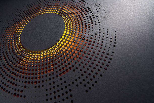 istock Dark radial halftone paper cutout design with glowing orange light beneath in modern abstract still life artwork 2207040321