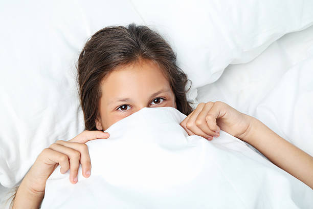 istock Beautiful girl sleeping in white bed 2207040682