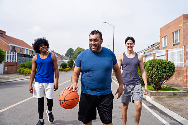 istock Friends walking ready to play basketball. 2207041869