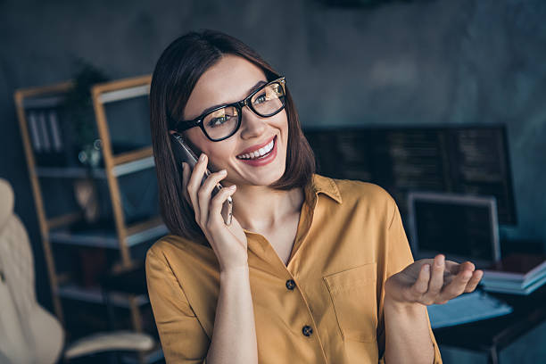 istock Portrait of attractive cheerful girl hr director assistant expert using device calling client at workplace workstation indoors 2207042708