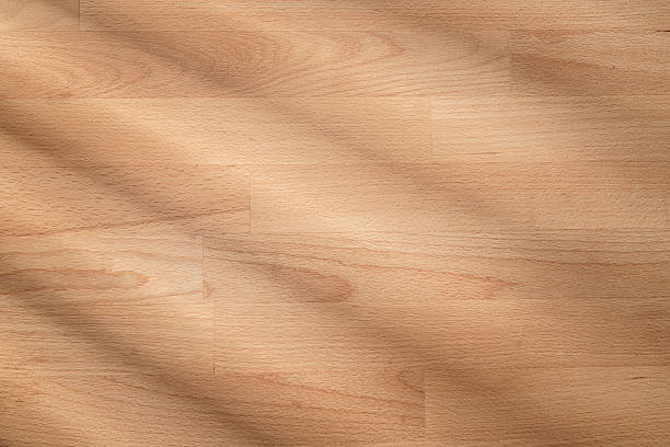 Wooden background with striped shadows. Hardwood paneling. Flat lay with copy space