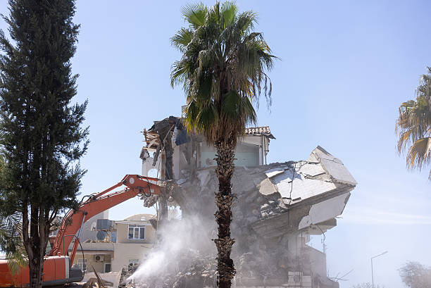 In the industrial area of the old factory, ancient buildings are being demolished and a modern city block of multi-storey comfortable buildings is being built. Contrast of antiquity and modernity.