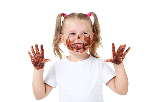istock Happy little girl in chocolate on white background 2207043330