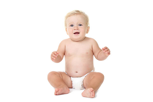 istock Baby girl sitting on white background 2207043904