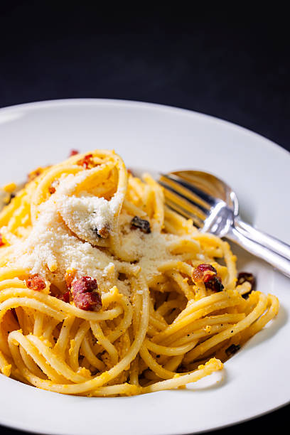istock close up of spaghetti carbonara in white bowl 2207046512