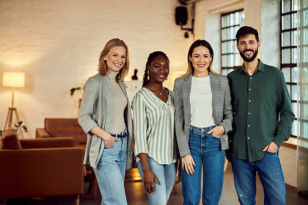 istock Group of Diverse Young Professionals Smiling in a Modern Office Setting 2207047394
